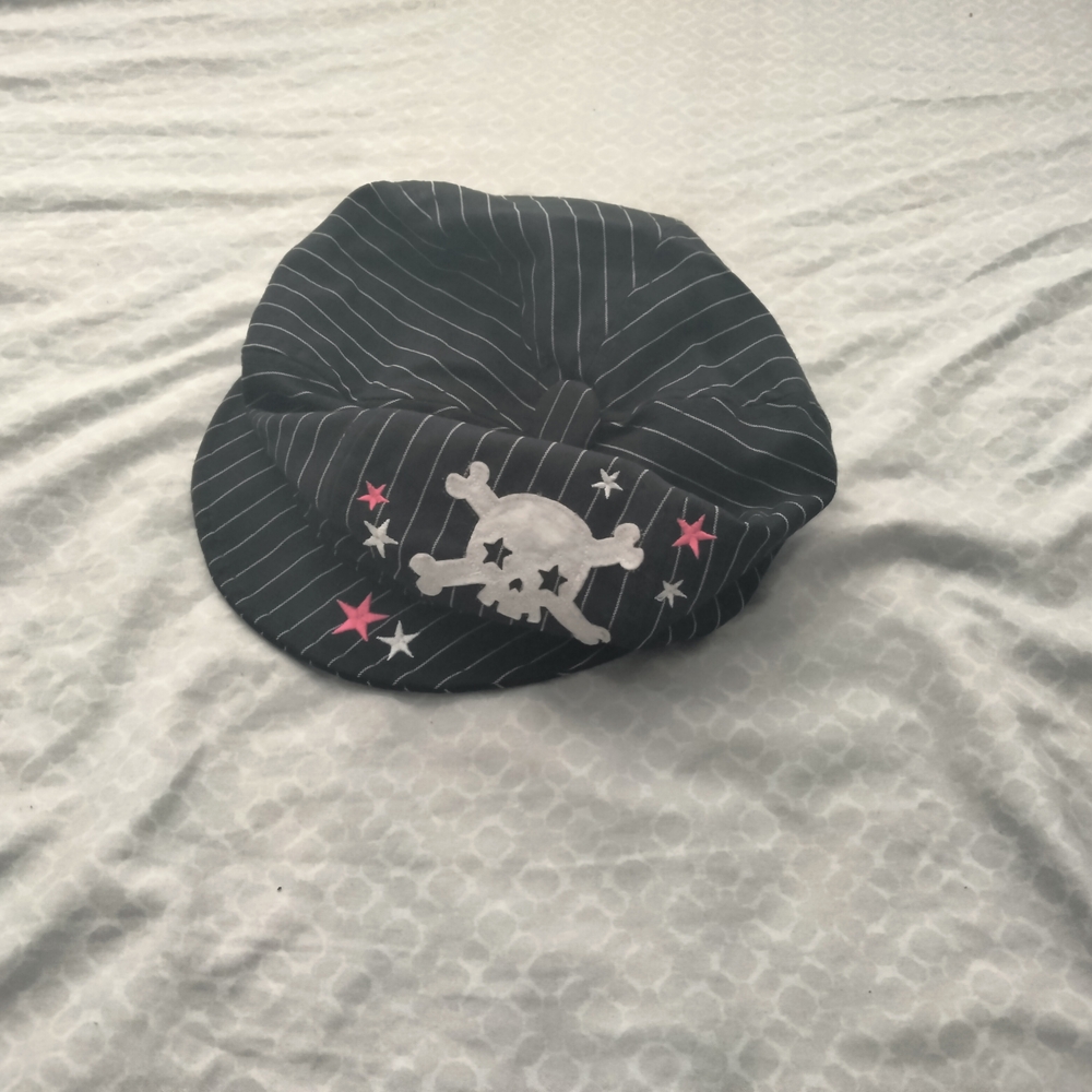 Black and White Striped Hat with Skull Design